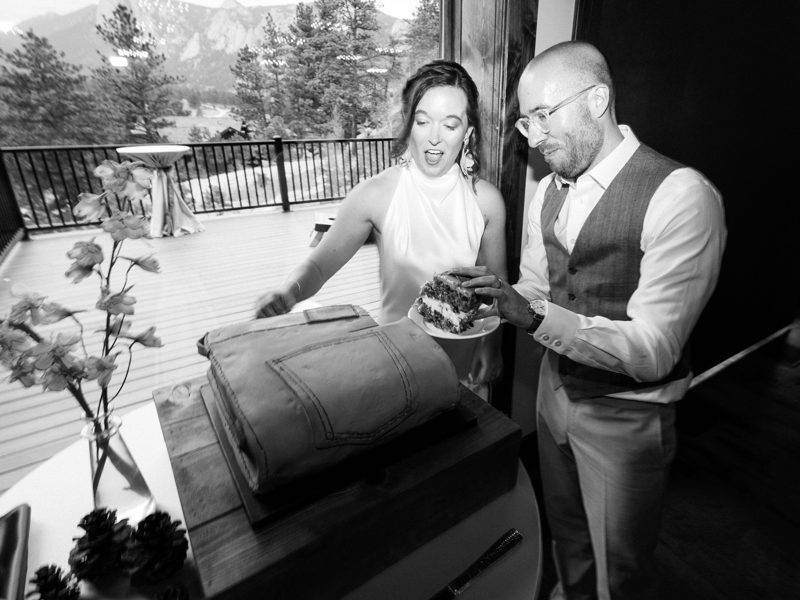 Black-and-white photo of the couple cutting the folded-jeans cake
